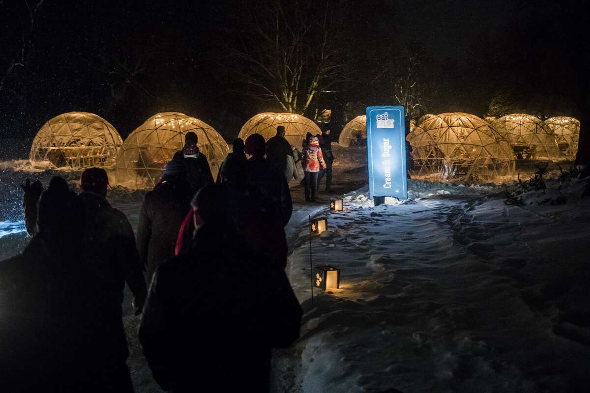 Guests take a short walk outside before entering their dining igloos during the Eat Great Winter event Monday, Feb. 17, 2020 at Dow Gardens. (Katy Kildee/kkildee@mdn.net)