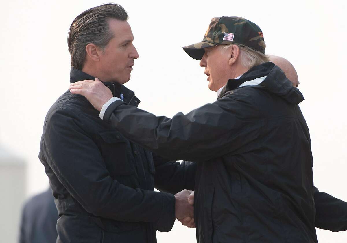 (FILES) In this file photo taken on November 17, 2018 US President Donald Trump greets California Governor-elect Gavin Newsom (L) as he disembarks from Air Force One upon arrival at Beale Air Force Base in California, as he travels to view wildfire damage. - In a rebuke to President Donald Trump, the governor of California on February 11, 2019 was set to sign an order to pull most of the National Guard troops deployed on the Mexico border. Governor Gavin Newsom's office said he was signing the order ahead of his State of the State speech on Tuesday."The border 'emergency' is a manufactured crisis," according to excerpts of the speech sent to AFP by his office. "And California will not be part of this political theater." (Photo by SAUL LOEB / AFP)SAUL LOEB/AFP/Getty Images
