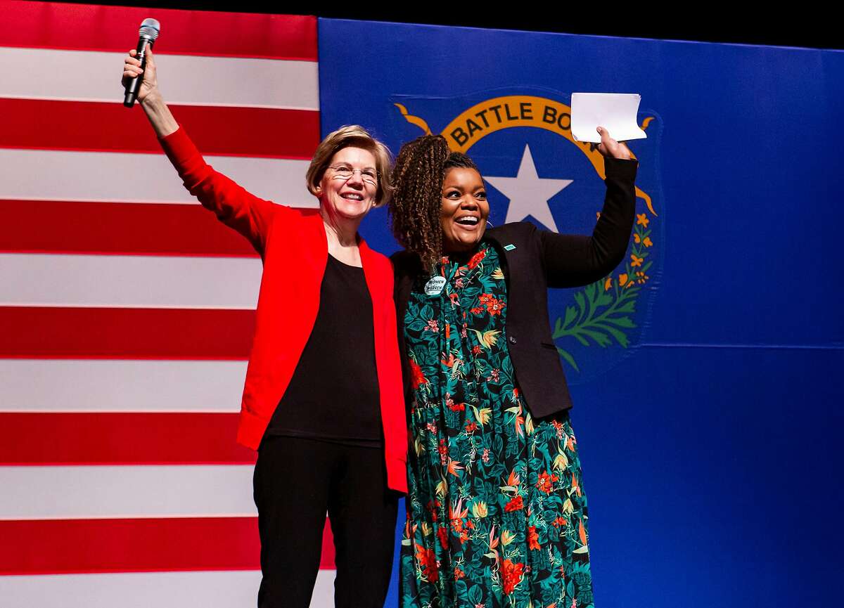 Democratic presidential candidate Sen. Elizabeth Warren, D-Mass., and Yvette Nicole Brown onstage during a campaign event at Centennial High School in Las Vegas on Saturday, Feb. 15, 2020.