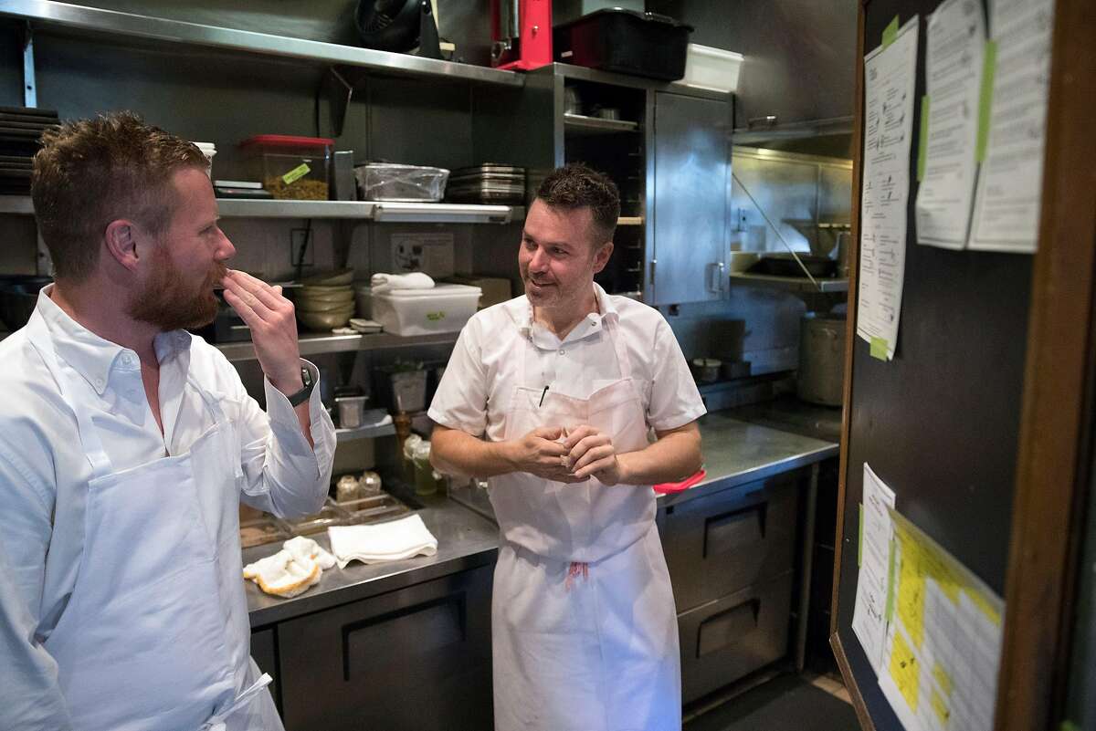 Chef Thomas McNaughton checks in with chef Ryan Pollnow at Flour + Water restaurant in San Francisco, Calif., on Wednesday, February 12, 2020. Contemporary Italian restaurant Flour + Water has become one of San Francisco?s most popular restaurants since it opened in 2009. Founders McNaughton and partners went on to found Ne Timeas Restaurant Group, one of roughly two-dozen small, local restaurant groups that have emerged in San Francisco in recent years. These groups are responsible for some of the city’s most popular restaurants, managing to endure the steep challenges of opening and keeping afloat a mid-priced to upscale restaurant in San Francisco.