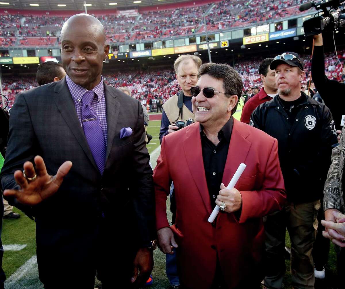 49er great Jerry Rice stands with former team owner Eddie DeBartolo on the field before the last regular season game played at Candlestick Park in 2013.