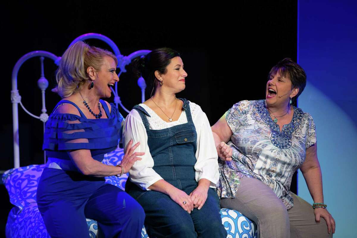 Michelle Lambert, left, Carla Sullivan, center, and Denise Smoker perform in Center Stage Theatre’s production of Mamma Mia!