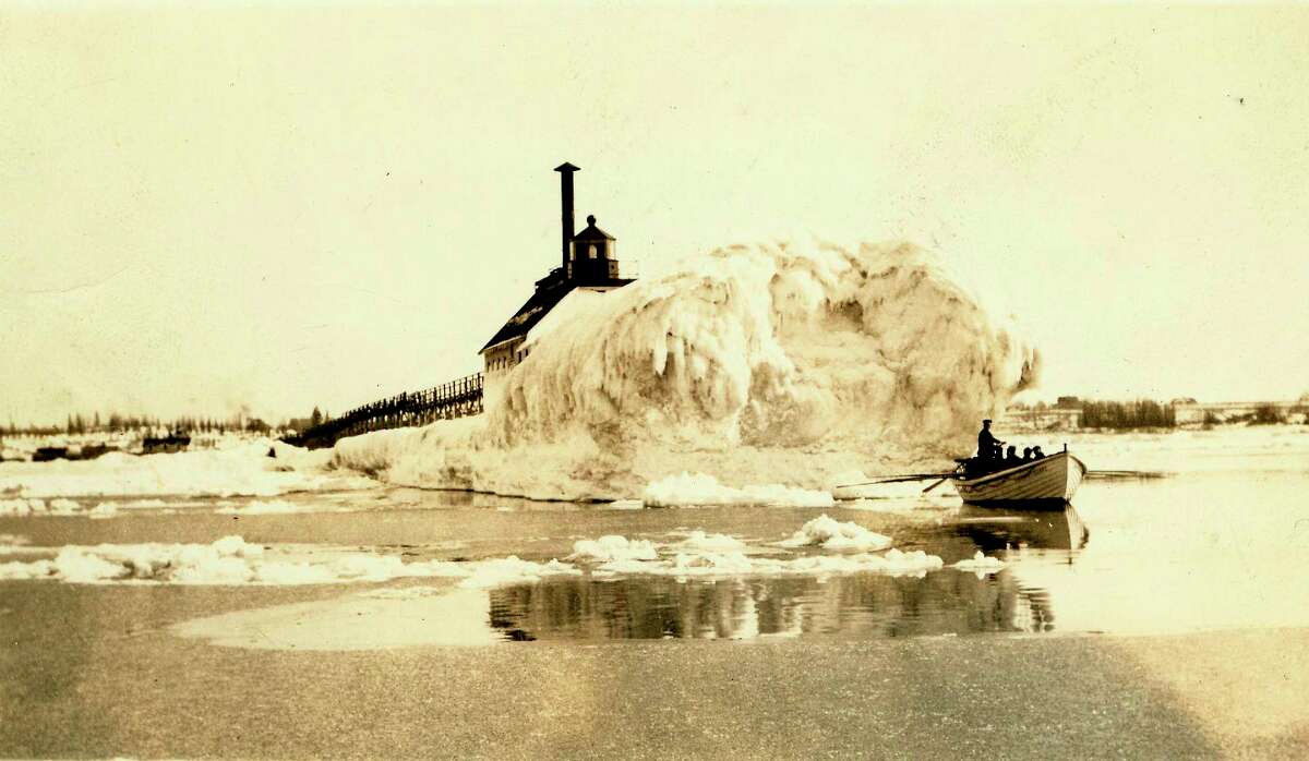 The lighthouse at Fifth Avenue Beach would get covered with large amounts of ice during winter as shown in this photograph form the 1890s.