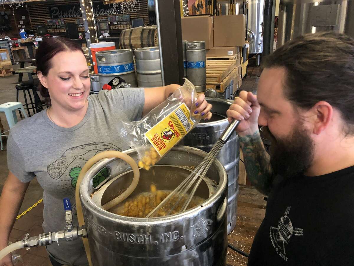 Panther Island brewers Ryan McWhorter and Sandra DiPretore added some Beaver Nuggets into the mash for a brown ale.