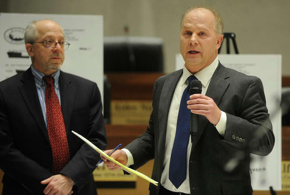 City Attorneys Russell Liskov, left, and Christopher Meyer deliver a presentation on how the Water Pollution Control Authority collects unpaid sewer bills to the Bridgeport City Council at City Hall in Bridgeport, Conn. on Monday, January 29, 2018.