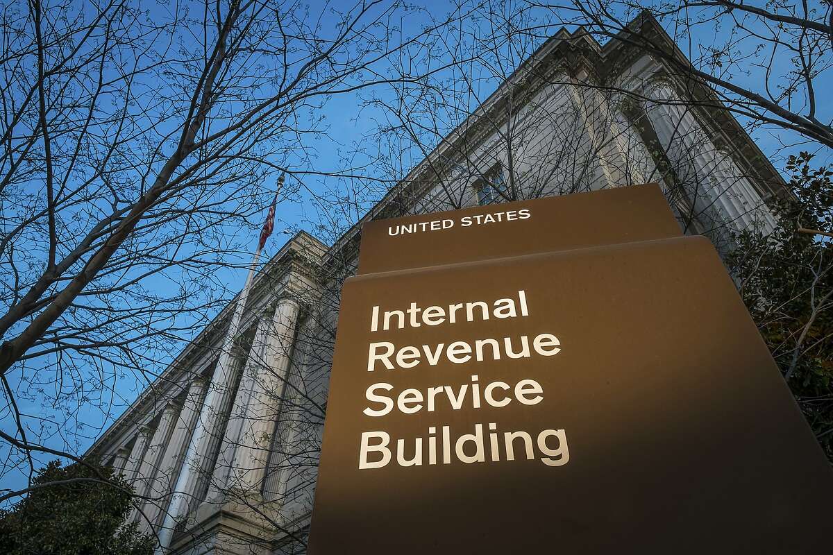 FILE - This April 13, 2014 file photo shows the headquarters of the Internal Revenue Service (IRS) in Washington. The agency said Wednesday, Feb. 19, 2020, that it is stepping up its efforts to visit high-income taxpayers who failed in prior years to file their tax returns on time. (AP Photo/J. David Ake, File)