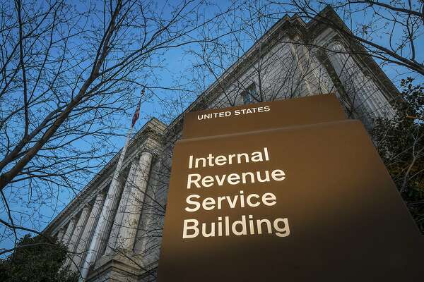 FILE - This April 13, 2014 file photo shows the headquarters of the Internal Revenue Service (IRS) in Washington. The agency said Wednesday, Feb. 19, 2020, that it is stepping up its efforts to visit high-income taxpayers who failed in prior years to file their tax returns on time. (AP Photo/J. David Ake, File)