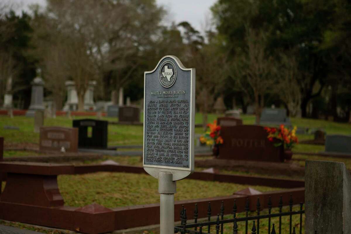 A historical marker stands next to the gravesite of Walter Burton, Wednesday, Feb. 19, 2020, in the Morton Cemetery in Richmond. Burton was born into slavery in North Carolina and became a successful farmer in Texas after buying land from his former owner after the end of the Civil War. Burton became the first black sheriff of Fort Bend County and also served in the Texas senate.