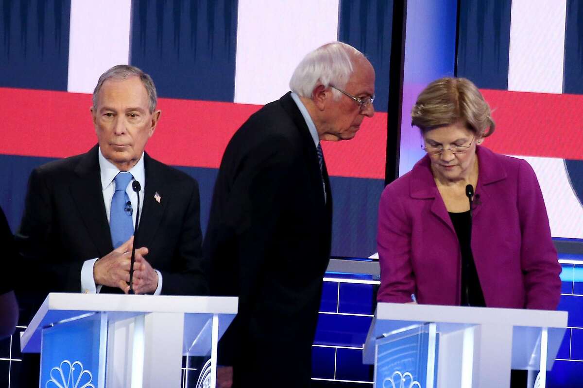 LAS VEGAS, NEVADA - FEBRUARY 19: Democratic presidential candidates (L-R) former New York City Mayor Mike Bloomberg, Sen. Bernie Sanders (I-VT) and Sen. Elizabeth Warren (D-MA) take a break during the Democratic presidential primary debate at Paris Las Vegas on February 19, 2020 in Las Vegas, Nevada. Six candidates qualified for the third Democratic presidential primary debate of 2020, which comes just days before the Nevada caucuses on February 22. (Photo by Mario Tama/Getty Images)