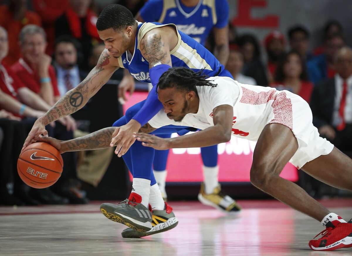 Tulsa Golden Hurricane guard Elijah Joiner (3) and Houston Cougars guard DeJon Jarreau (3) battle for the ball during the first half of an NCAA basketball game at Fertitta Center Wednesday, Feb. 19, 2020, in Houston.