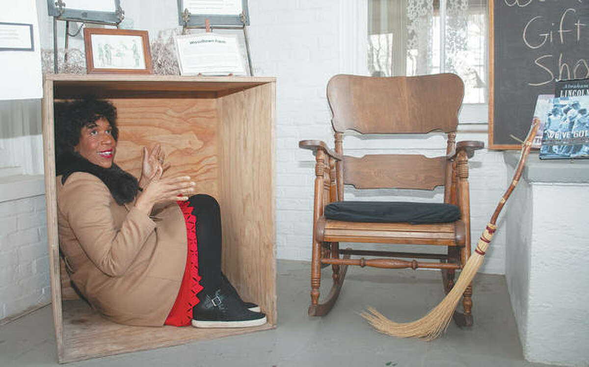 Lt. Gov. Juliana Stratton sits in February 2020 in a box at Woodlawn Farm that a slave used to mail himself to a free state. Woodlawn Farm is part of the Underground Railroad, a network of people who helped slaves find safe passage to free states.