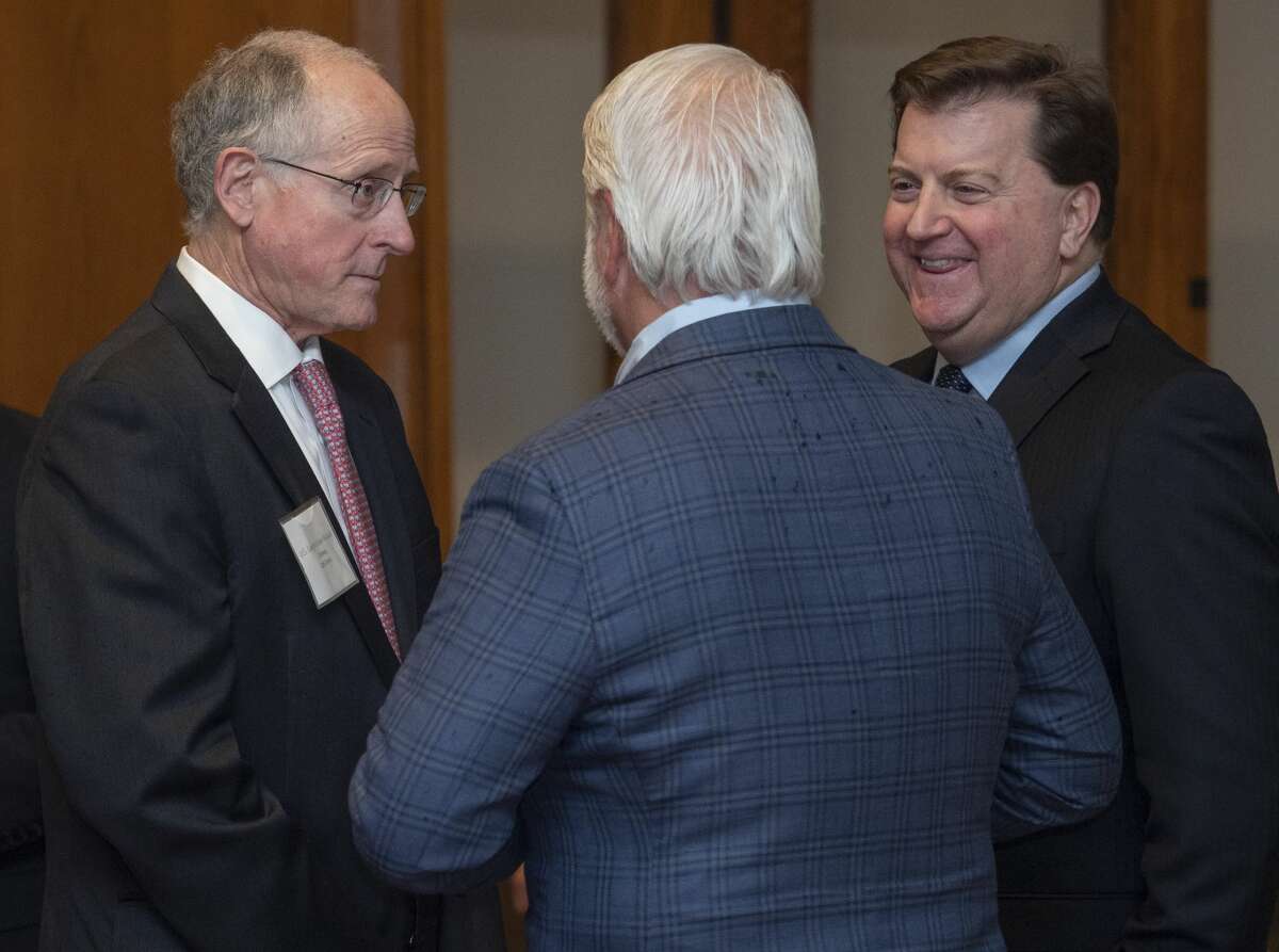 U.S. Rep. Mike Conaway, left, talks with Pat Bond, center, and Kirk Edwards at the Permian Basin Water in Energy Conference dinner Feb. 19 at the Petroleum Club.