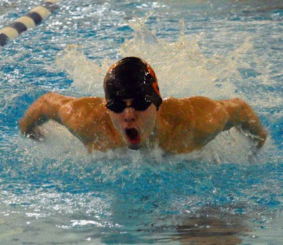 Edwardsville’s Logan Mills swims in the 200-yard medley relay during the Southern Illinois High School Boys Championships on Feb. 13 at Chuck Fruit Aquatic Center.