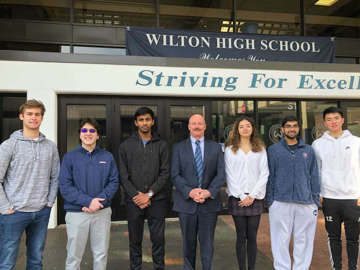 From left are Maden Herve, Alexander Koutsoukos, Vignesh Subramanian, Principal Robert O'Donnell, Ashleigh Coltman, Rishabh Raniwala and Jeffrey Huang at Wilton High School.