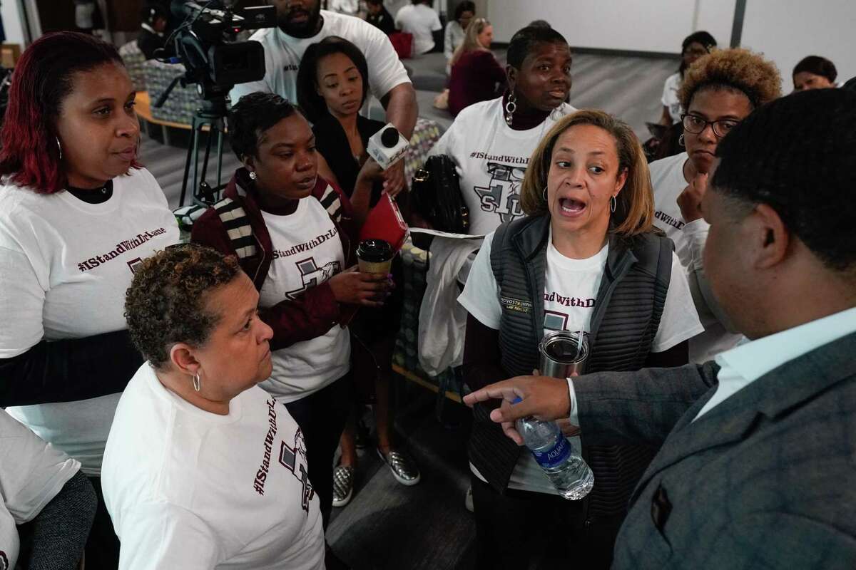 Tracie Payne, second from right, among other alumni, who spoke about their support of fired Texas Southern University president Austin Lane, as they wait as the board of regents meets in executive session Thursday, Feb. 20, 2020 in Houston. The TSU board is meeting for the first time since giving their notice of termination for sidelined TSU president Austin Lane earlier this month.