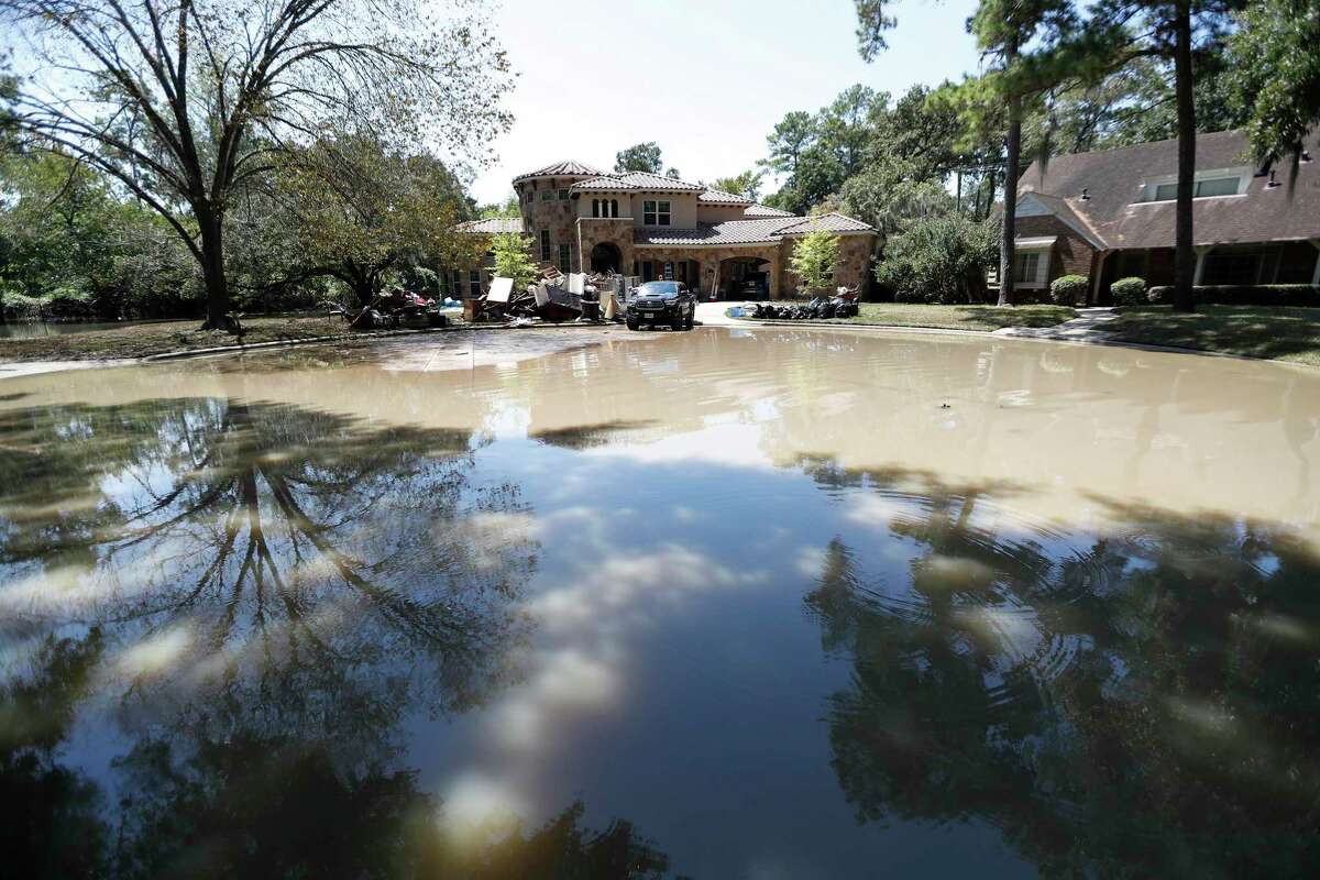 Flood water remains at the end of a cul-de-sac in the Memorial Glen subdivision, west of Beltway 8, near Memorial and Wilchester, Friday, Sept. 8, 2017, in Houston.