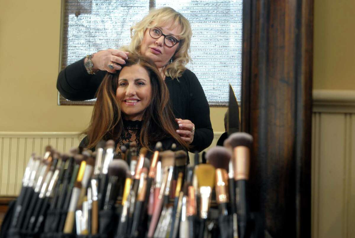 Janet Ventriglia works as a makeup and hair stylist at H Salon, in Fairfield, Conn. Ventriglia is seen here with one of the salon’s co-owner Jackie Fernandes on Feb. 20th, 2020.