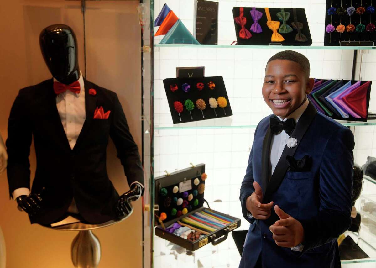 Brice Everhart, 13, stands at his Vallaire’s Men pop-up shop in the Galleria Friday, Feb. 7, 2020, in Houston. He has a line of bow ties, pocket squares, and lapel pins. He started his business four years ago at age 9.
