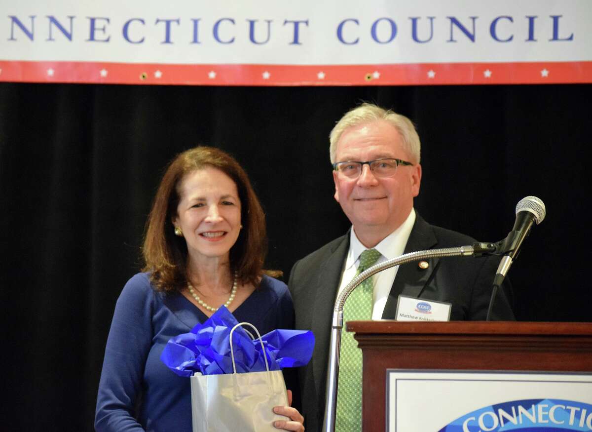 Bethel First Selectman Matt Knickerbocker presents state Rep. Gail Lavielle with the Connecticut Council of Small Towns' Town Crier Award on Feb. 18, for her work last year in helping to fend off efforts to regionalize school districts around the state as well as other work she did in advocating for public policies that benefit Connecticut's small towns.