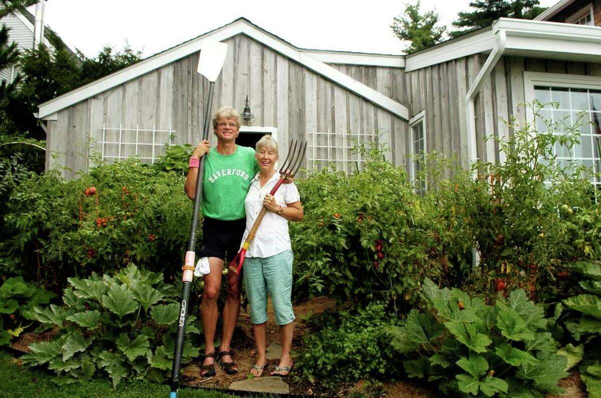 Rob and Sharon Slocum at their Weed Circle home in Stamford, Conn. on Monday August 16, 2010. Rob is a rower who's competed around the world and Sharon is a landscape designer who has planted their backyard with both vegetable and decorative plants.
