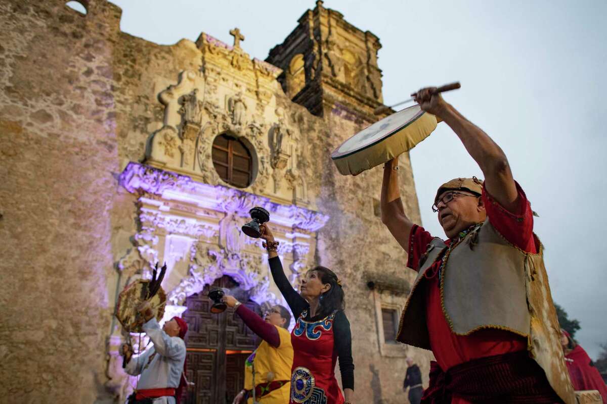 John Hernandez, right, and other members of the Native American Intertribal Group hold a four directions ceremony prior to the Mission San José Tricentennial Inaugural Celebration Holy Mass with Archbishop Gustavo Garcia-Siller on Wednesday night, Feb. 19, 2020. The mission was founded in 1720 and is now part of the San Antonio Missions National Historical Park. It is a designated World Heritage Site.