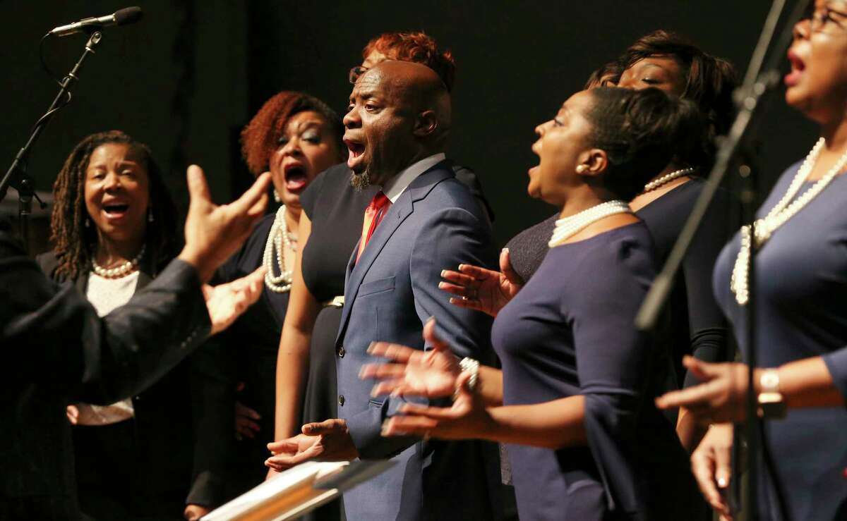 The gospel ensemble from Resurrection Church performs the National Anthem at the investiture ceremony for Jason K. Pulliam, the first African-American appointed as a federal judge in the U.S. District Court’s Western District of Texas. Pulliam, 48, is also the district’s youngest member of the federal judiciary.