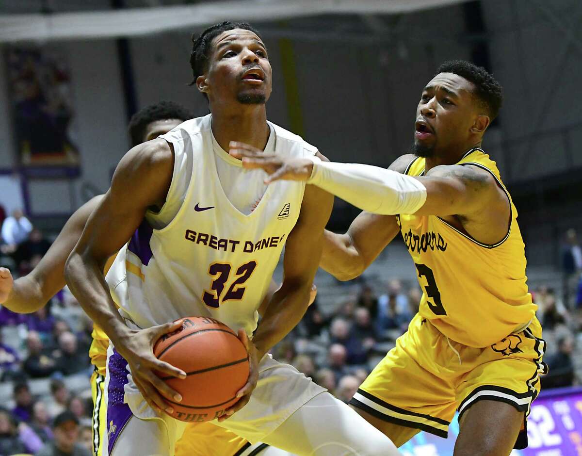University at Albany's Romani Hansen drives to the basket against Maryland-Baltimore County's K.J. Jackson during a game at SEFCU Arena on Thursday, Feb. 20, 2020 in Albany, N.Y. (Lori Van Buren/Times Union)