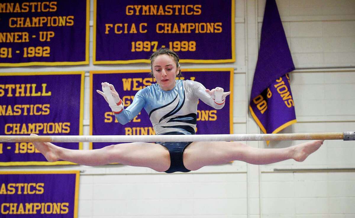 Wilton's Olivia Mannino competes on the uneven bars during the Ro Carlucci FCIAC Championships for gymnastics at Westhill High School on Feb. 15, 2020 in Stamford, Connecticut.