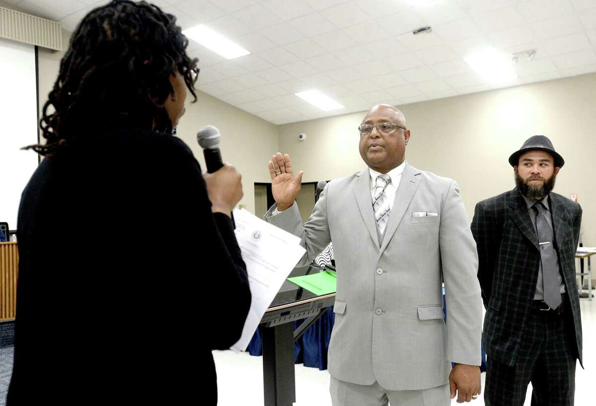 Beaumont ISD swears in new trustees Robert Dunn (left) annd Kevin Reece individually during its regular board meeting Thursday night. The all-local board is a first in years after being taken over by the TEA in 2014. Photo taken Thursday, February 20, 2020 Kim Brent/The Enterprise