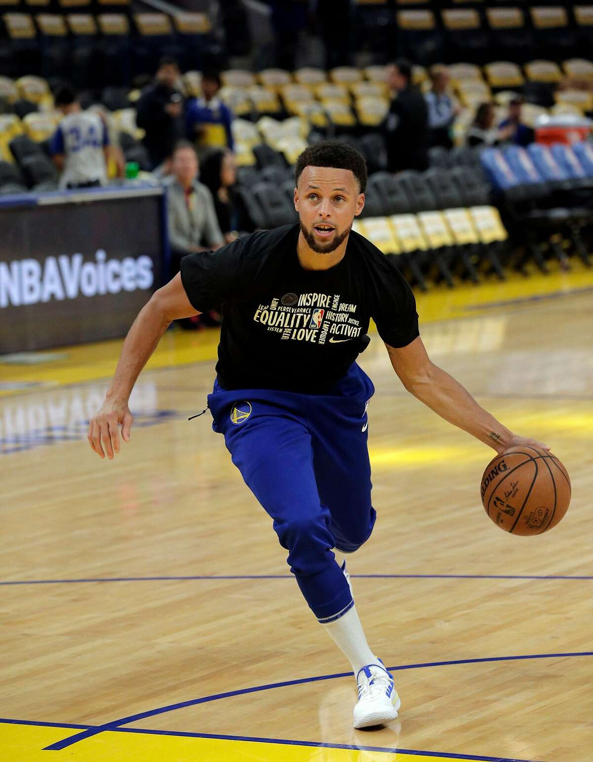 Stephen Curry (30) dribbles around as he works out before the Golden State Warriors played the Houston Rockets at Chase Center in San Francisco, Calif., on Thursday, February 20, 2020.