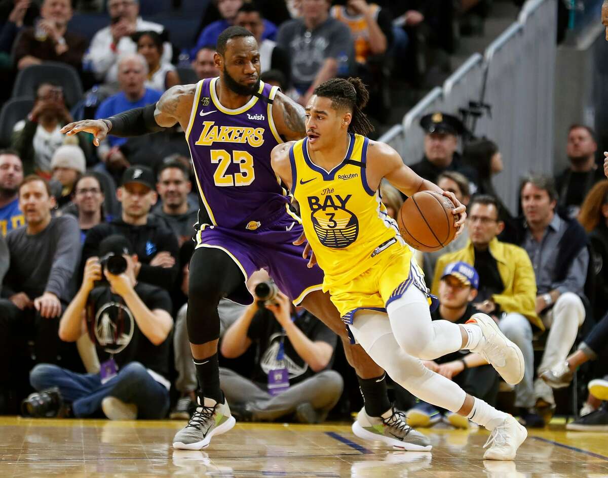 Golden State Warriors' Jordan Poole drives against Los Angeles Lakers' LeBron James during Lakers' 125-120 win in NBA game at Chase Center in San Francisco, Calif., on Saturday, February 8, 2020.