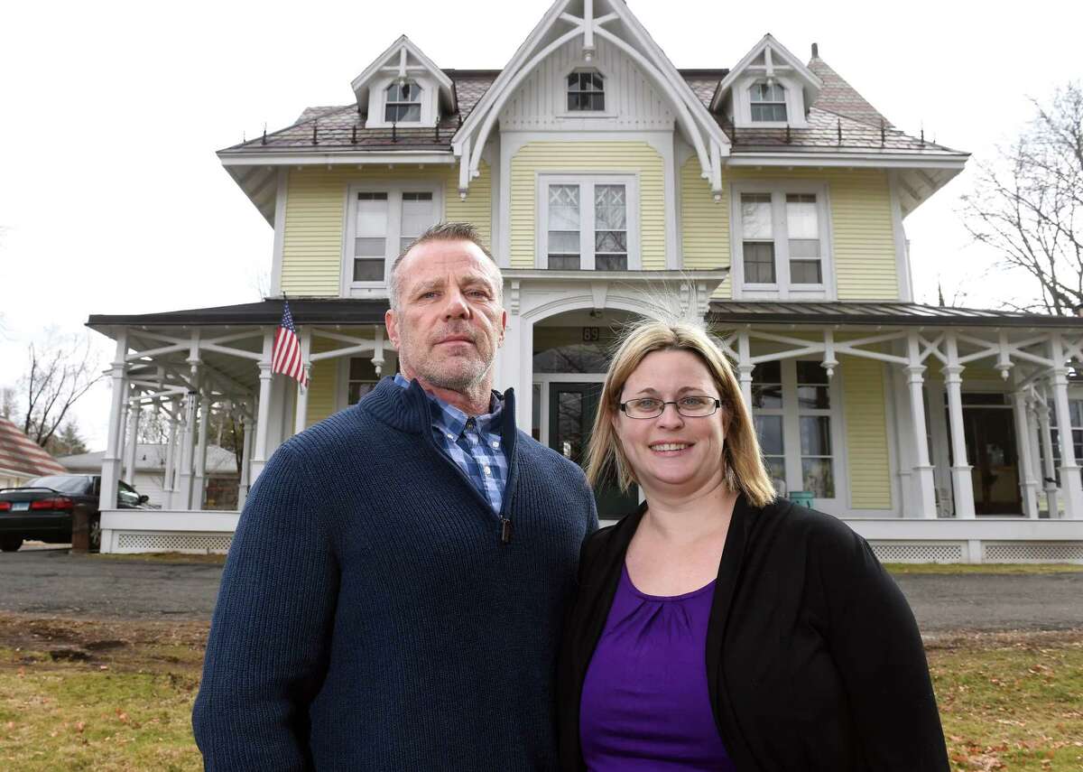 Rick DelValle and his wife, Jess, photographed outside of The Recovery Mansion, one of A New Beginning Recovery Houses, in the Fair Haven Heights section of New Haven.