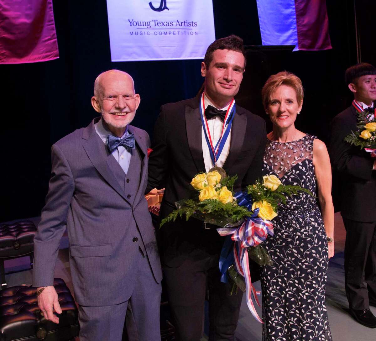 YTA Founder Jim Pokorski, 2019 Grand Prize winner Artem Kuznetsov, and YTA President/CEO Susie Pokorski. After a pause since 2019 due to the COVID-19 pandemic the Young Texas Artists Music Competition and Awards returns to downtown Conroe March 10-12.