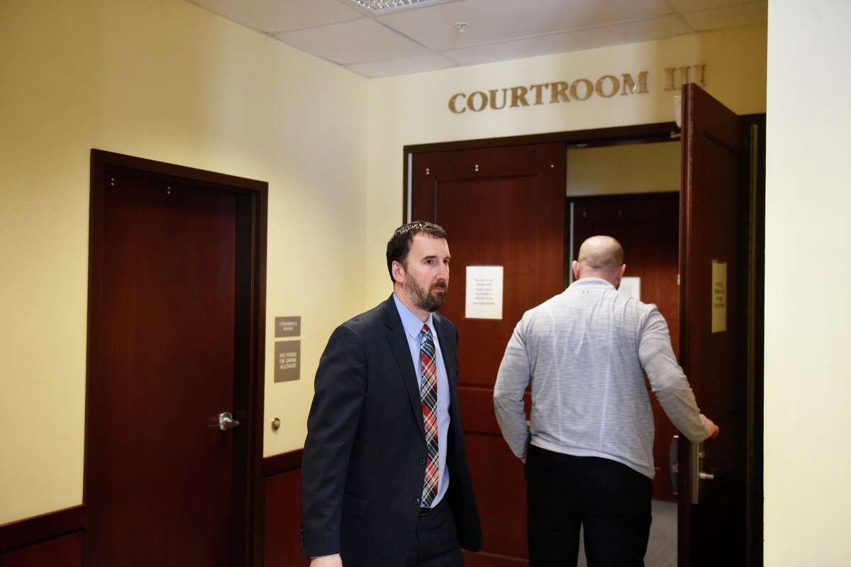 Albany County Chief Assistant District Attorney David Rossi heads to court Friday. He and five of his co-workers will begin taking the stand Friday at a hearing being held to determine if the trial of a double murderer Edward Mero's was tainted by outside work a prosecutor did for his attorney.