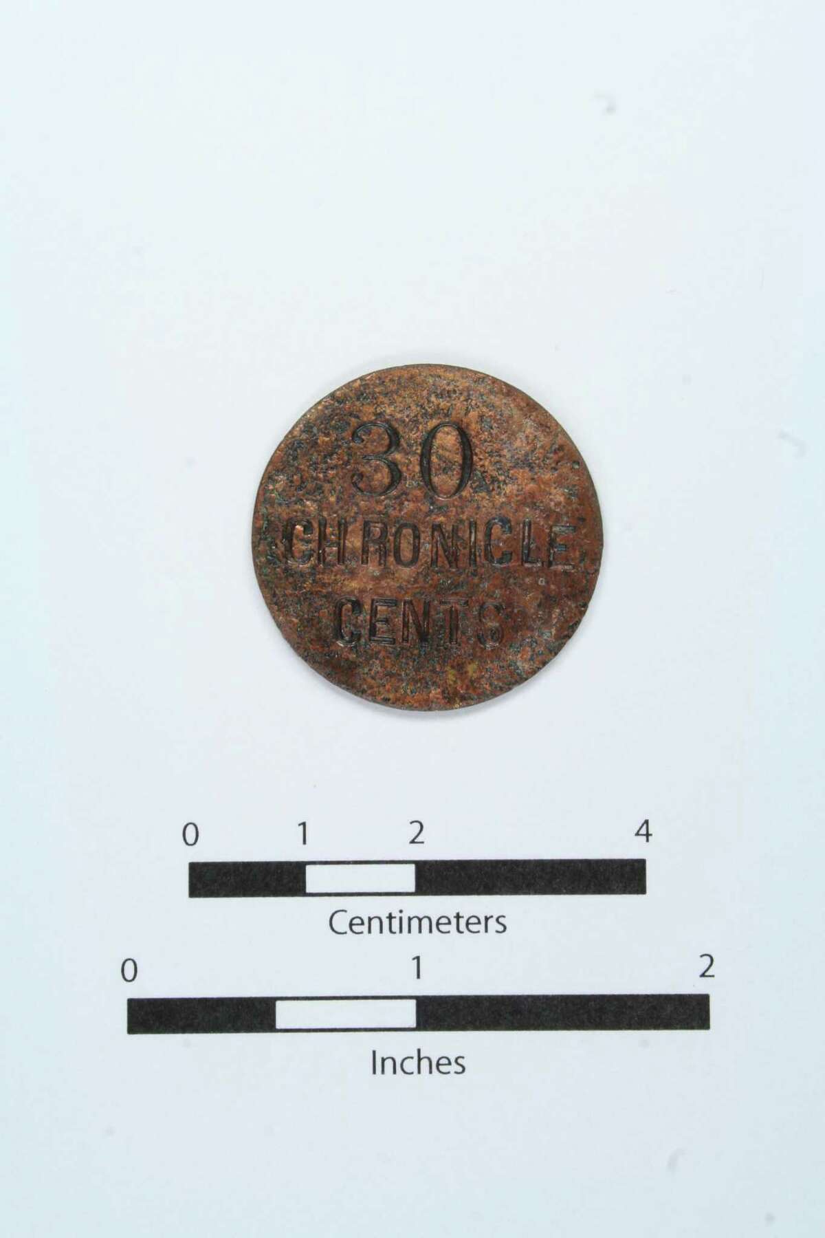 Local archaeologists found this mystery "Houston Chronicle" coin in Houston. But what is it?