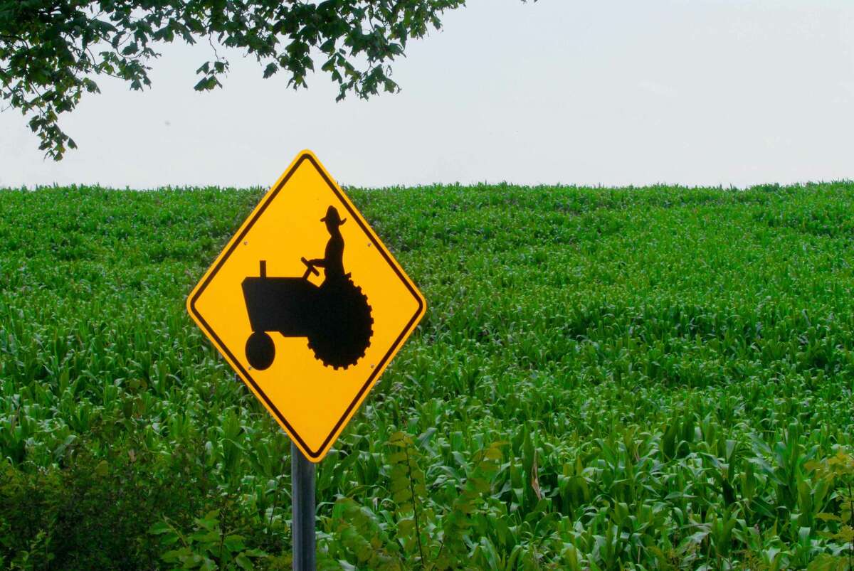 Albany Times Union Staff Photo--Michael P. Farrell--A tractor crossing sign at a corn field on route 30A in Fultonville, New York July 21, 2006.
