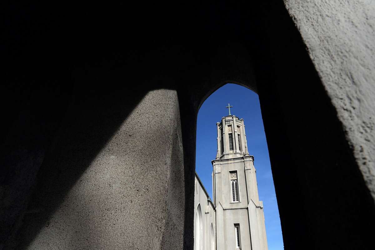 The steeple of St. Ambrose Church as seen through a decorative arch on the side portico in Berkeley, Calif., on Sunday, February 16, 2020.