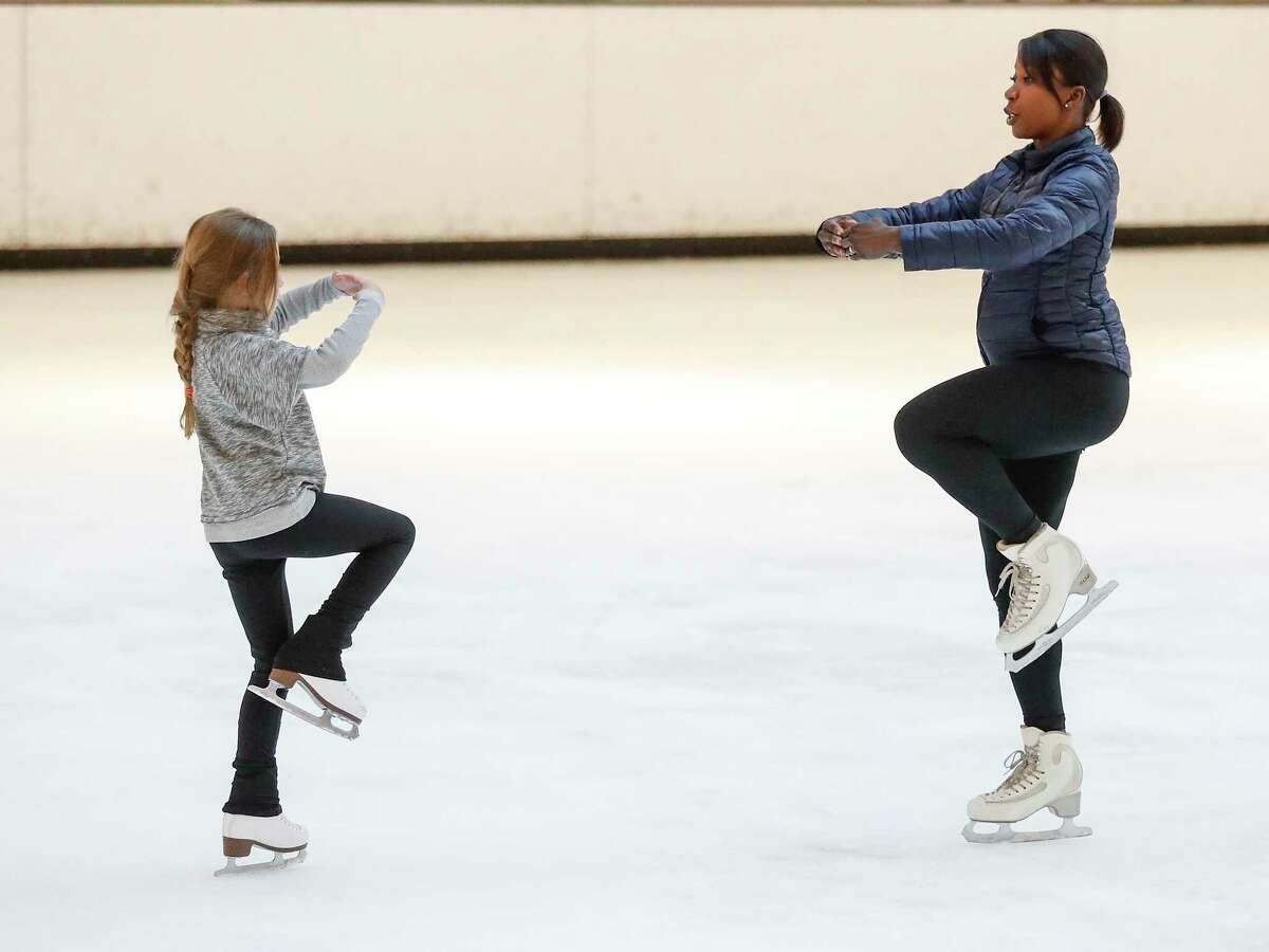 Figure skater Dayyanah Coleman coaches Heart Heimbinder, 7, at Ice at the Galleria.