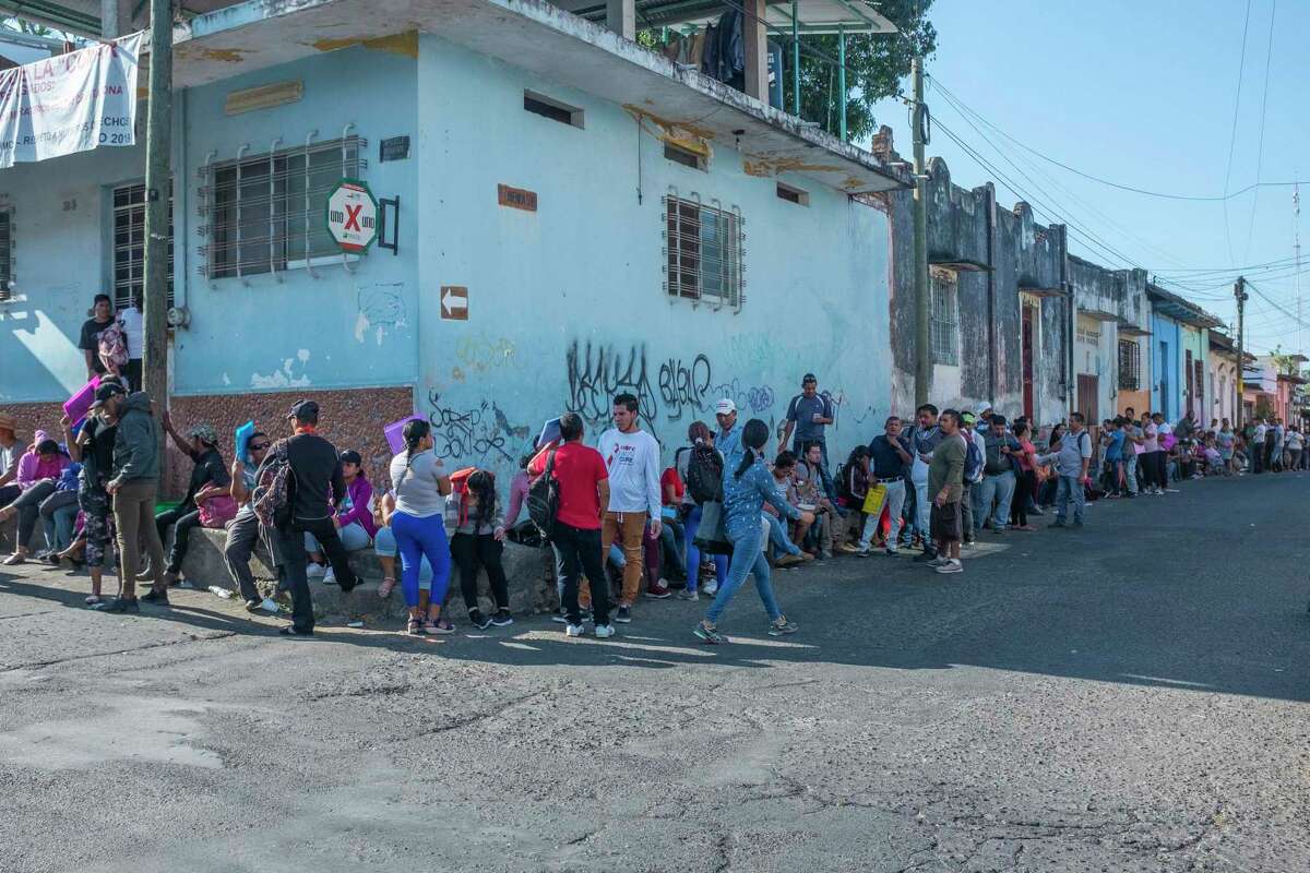 Thousands of migrants returned to southern Mexico, and now seek visas to work while waiting to return to the north. Here migrants line up outside the offices of COMAR (Comisión Mexicana de Ayuda a Refugiados) in Tapachula.
