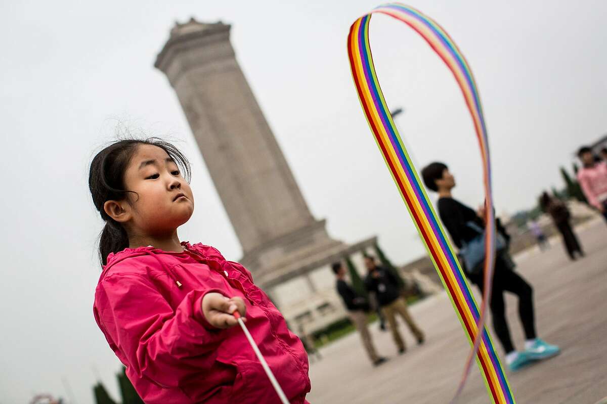 Child at play in Tiananmen Square, China