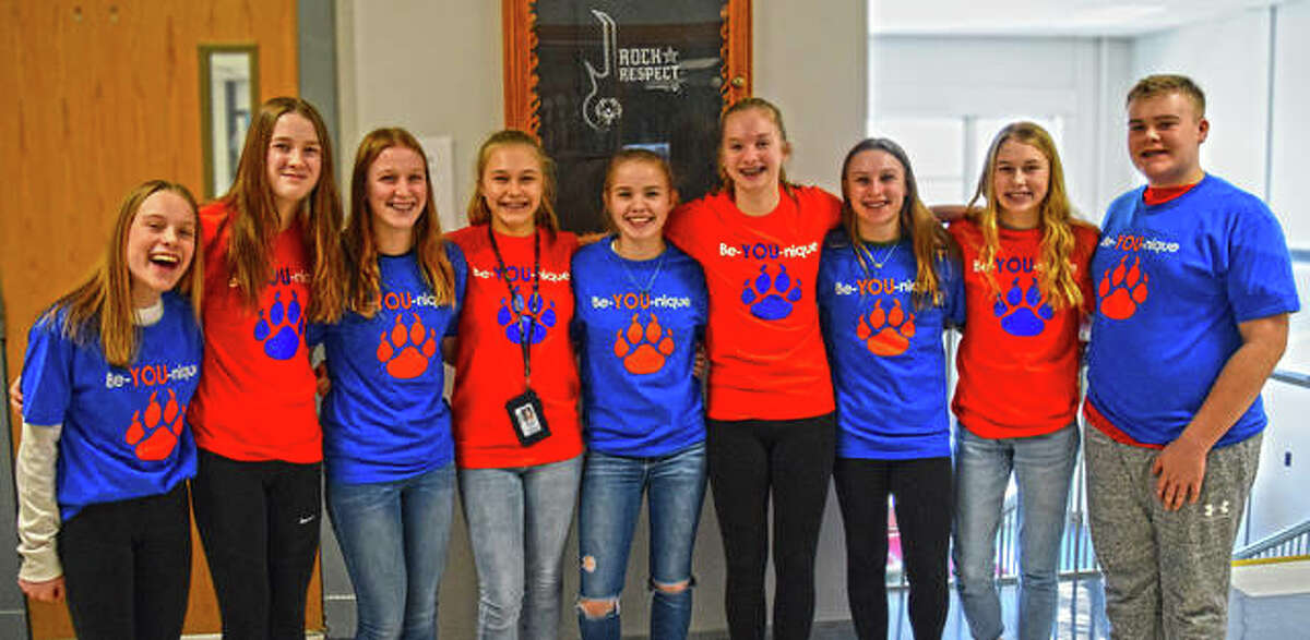 Lincoln Middle School’s eighth grade GO members show off their Be-YOU-Nique Week t-shirts on Friday.