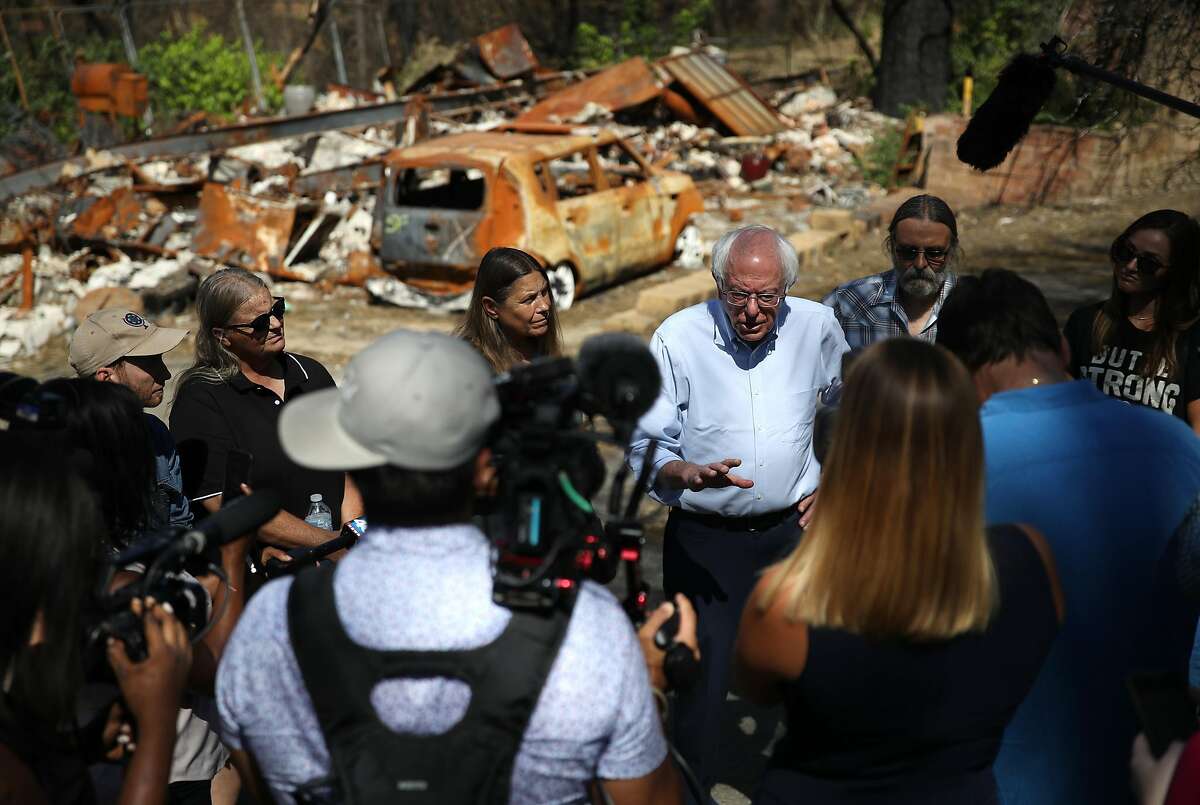 PARADISE, CALIFORNIA - AUGUST 22: Democratic presidential candidate U.S. Sen. Bernie Sanders (I-VT) talks with members of the media as he tours a mobile home park that was destroyed by the Camp Fire on August 22, 2019 in Paradise, California. Bernie Sanders is visiting the communities that were devastated by the Camp Fire last year. (Photo by Justin Sullivan/Getty Images) PARADISE, CALIFORNIA - AUGUST 22: Democratic presidential candidate U.S. Sen. Bernie Sanders (I-VT) talks with members of the media as he tours a mobile home park that was destroyed by the Camp Fire on August 22, 2019 in Paradise, California. Bernie Sanders is visiting the communities that were devastated by the Camp Fire last year. (Photo by Justin Sullivan/Getty Images)