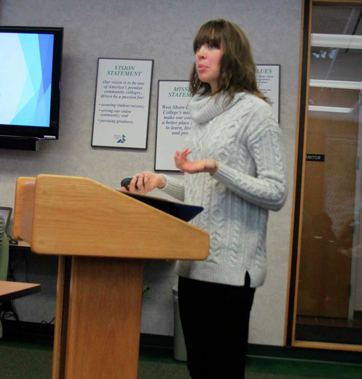 West Shore Community College director of Enrollment & Student Engagement Annie Jacobson talks with the board of trustees about the MI-BEST plan that is being implemented at the college to help eliminate barriers so students can succeed. (Ken Grabowski/News Advocate)