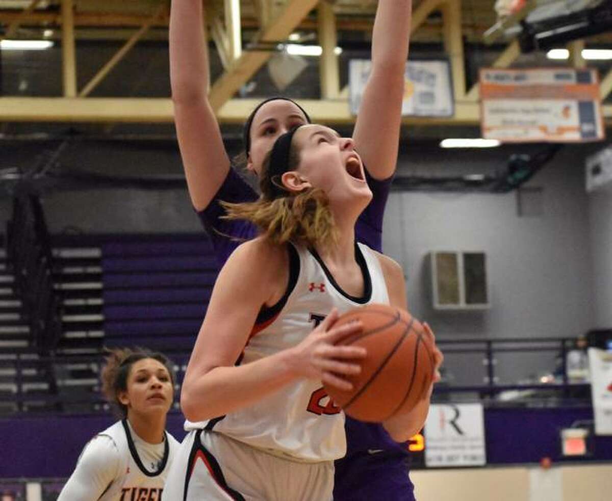 Edwardsville center Katelynne Roberts goes up for a contested shot in the first quarter against Collinsville.