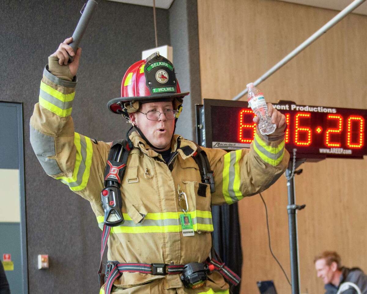Selkirk Firefighter Todd Holmes participates in the 32nd Annual CF Climb at the 42-floor Corning Tower in Albany NY on Saturday, Feb. 22 to benefit the Cystic Fibrosis Foundation a?” Northeastern New York Chapter (Jim Franco/Special to the Times Union.)