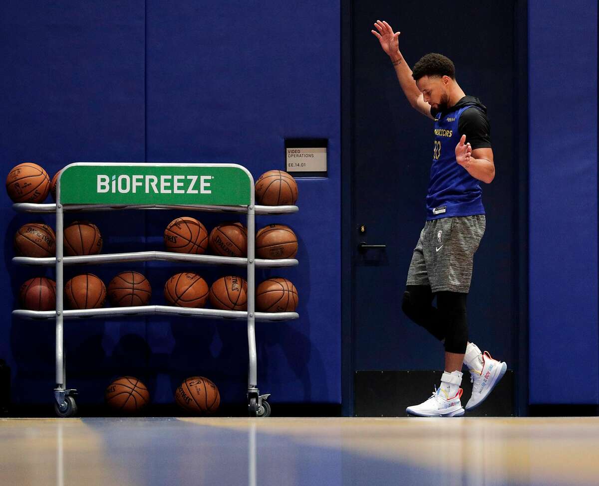 Stephen Curry walks around the court as he shoots around during an off-day practice after being cleared to do full contact practices at Chase Center in San Francisco, Calif., on Saturday, February 22, 2020.
