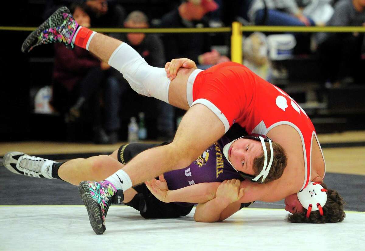 Westhill’s Thomas Mazur works to flip over NFA’s Theran Vanase during the Class LL championship on Saturday.