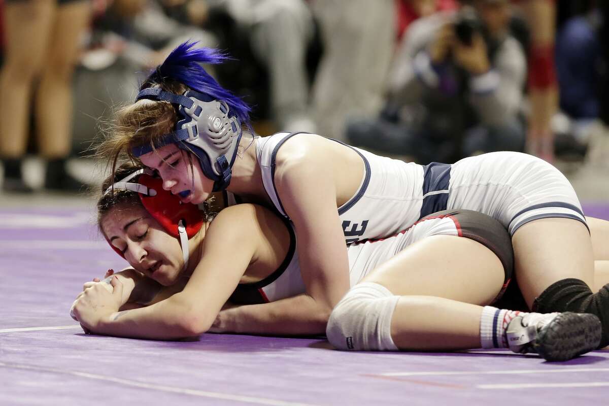 College Parks Olivia Degeorgio, top, and Tascosa's Mia Diaz, bottom, in their Class 6A-95lbs championship match of the state high school wrestling championships Saturday, Feb. 22, 2020 at the Berry Center in Cypress, TX.