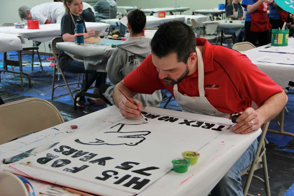 In this Pioneer file photo, area families practiced their painting skills during a Festival of Banners workshop at Artworks in 2020. Festival of Banners returns for 2022. Residents of all ages may paint banners which will be displayed on light posts around Big Rapids. One side of the banner shows the business sponsors, while the other side displays artwork done by kids, teens and adults.