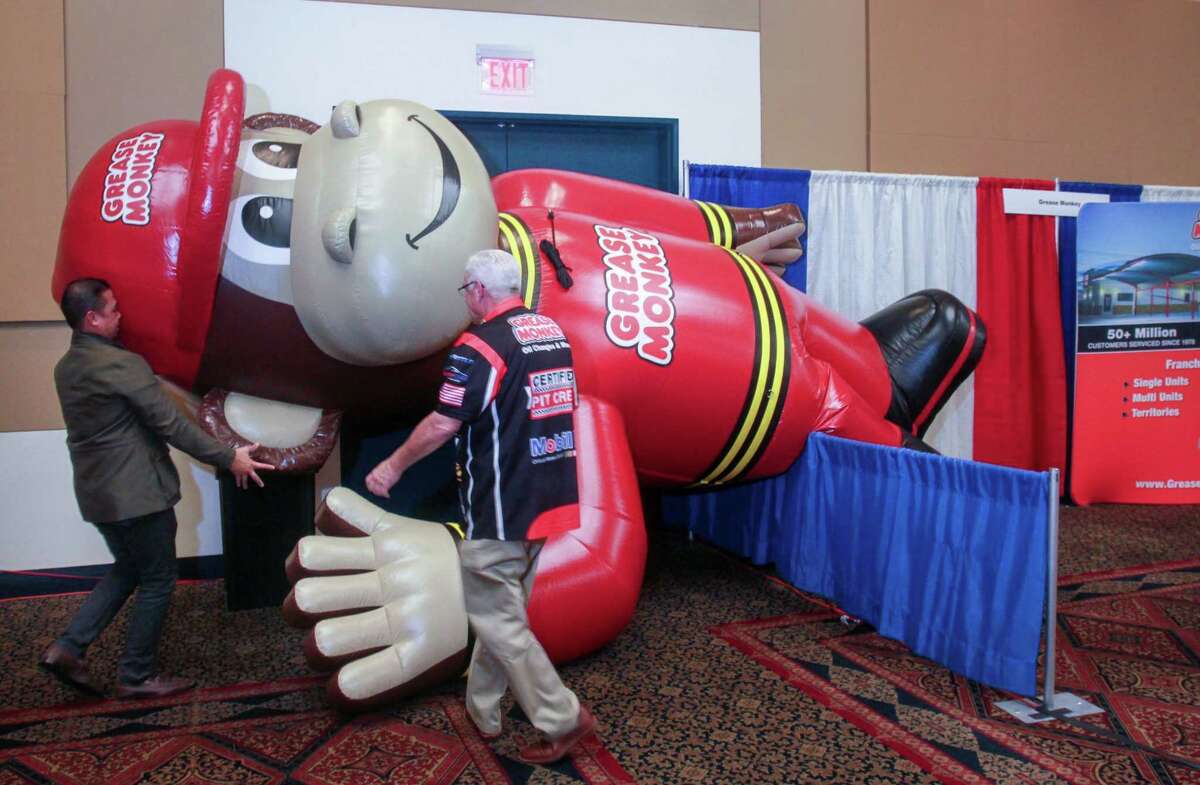 An inflatable for Grease Monkey Oil Changes & More goes up at the Great American Franchise Expo in Stafford on February 23, 2020.